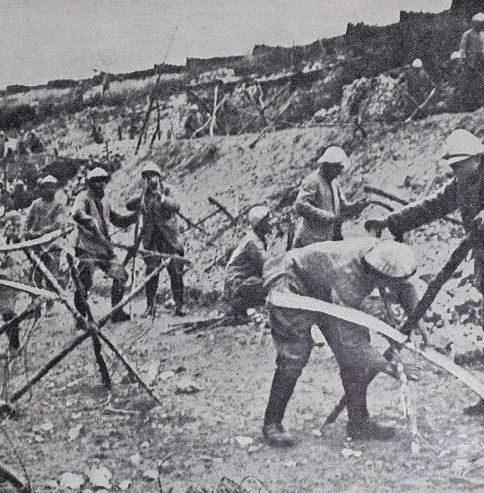 French soldiers at Verdun repairing entanglements, July 1916.